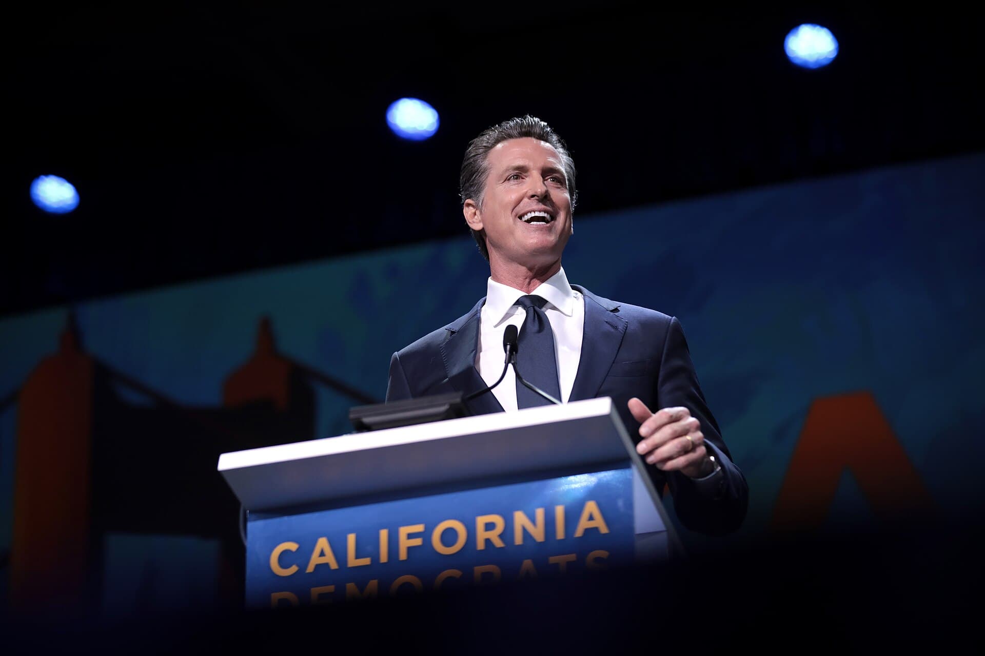 California Governor Gavin Newsom speaking with attendees at a Democratic Party convention