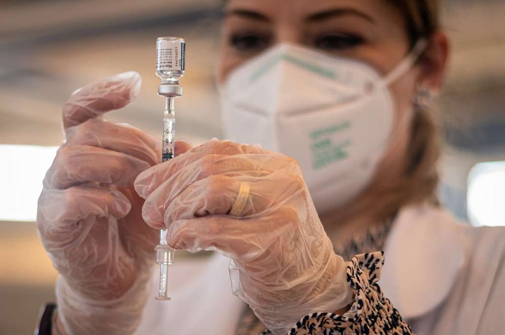 Healthcare worker preparing vaccine